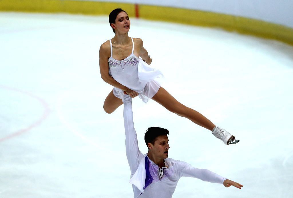 Natalia Zabiiako and Alexander Enbert perform at a competitive pair skating event