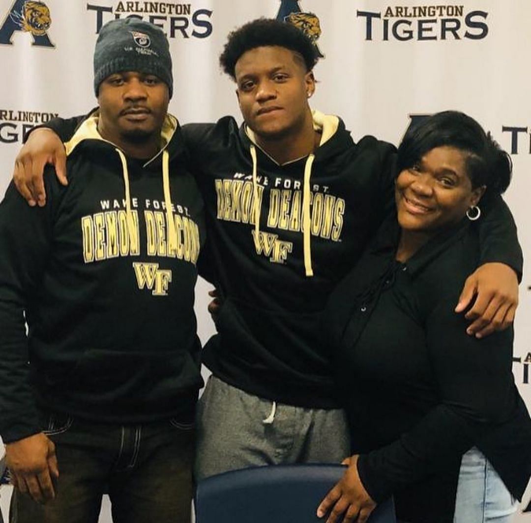 Kenneth Walker III posing for a picture with his mother, Patricia Jones(R), and his father, Kenneth Walker II(L)