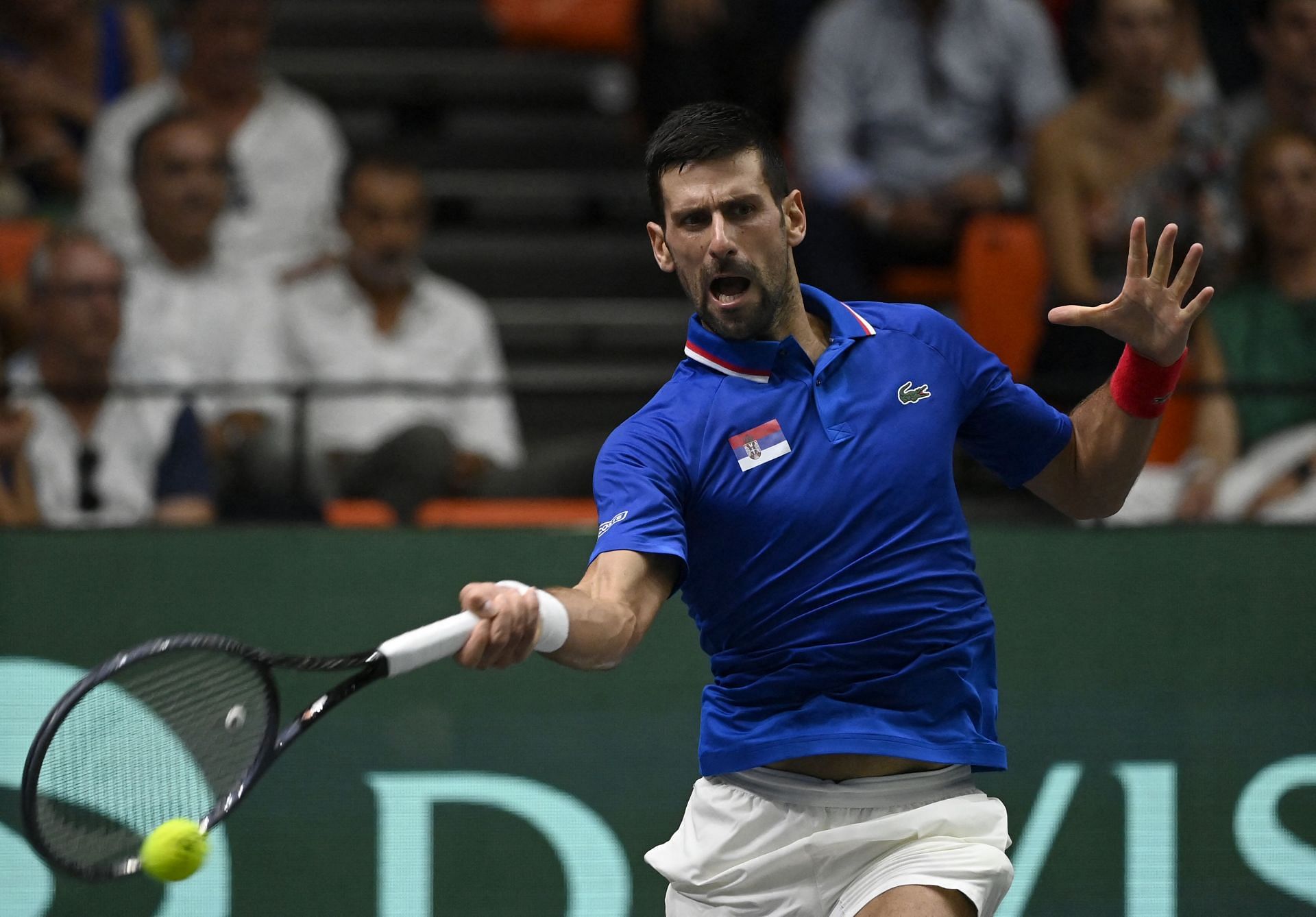 Novak Djokovic hits a forehand during Serbia vs Spain group stage tie