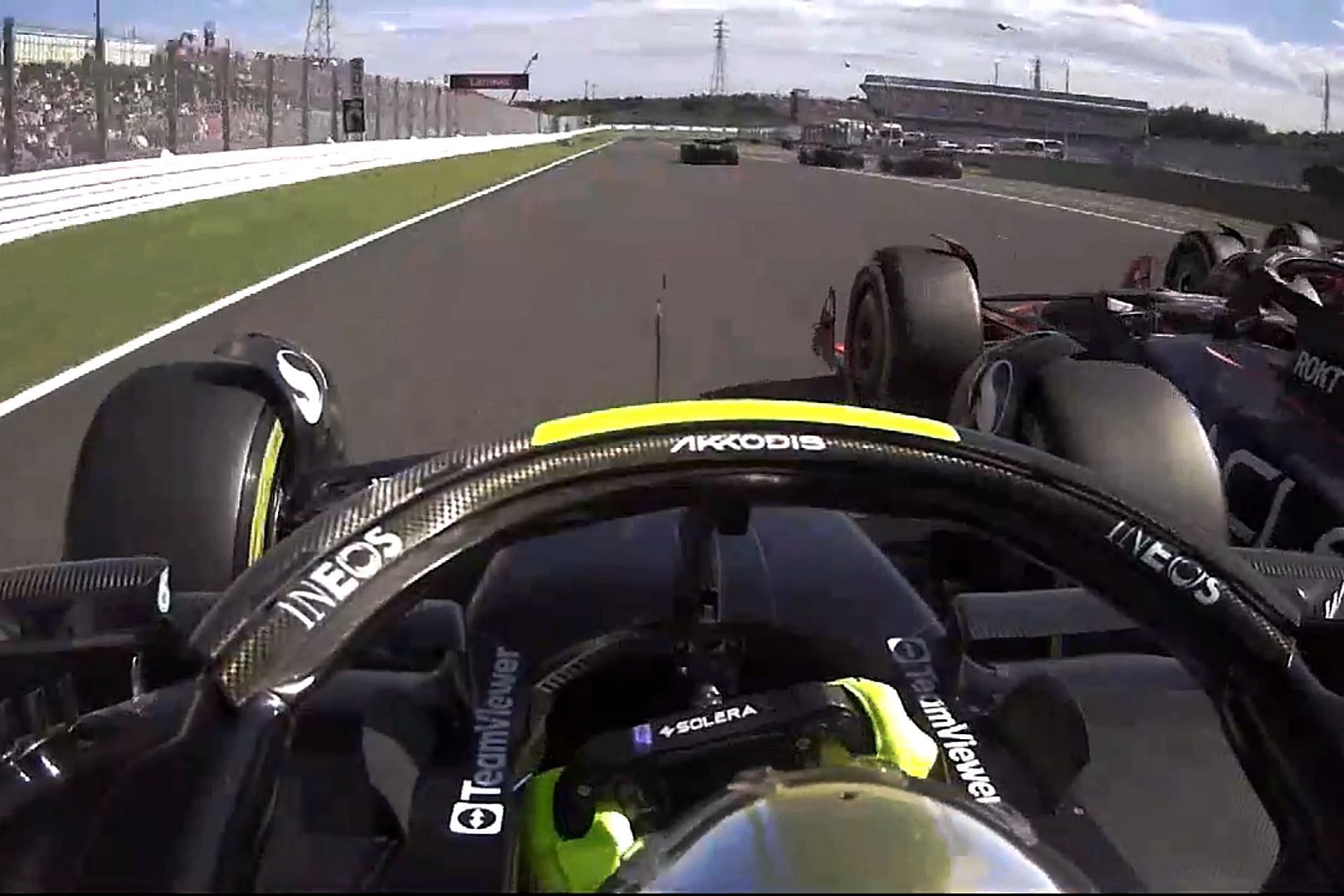Lewis Hamilton getting hit by Sergio Perez at the start of the 2023 F1 Japanese Grand Prix (Image via F1TV)