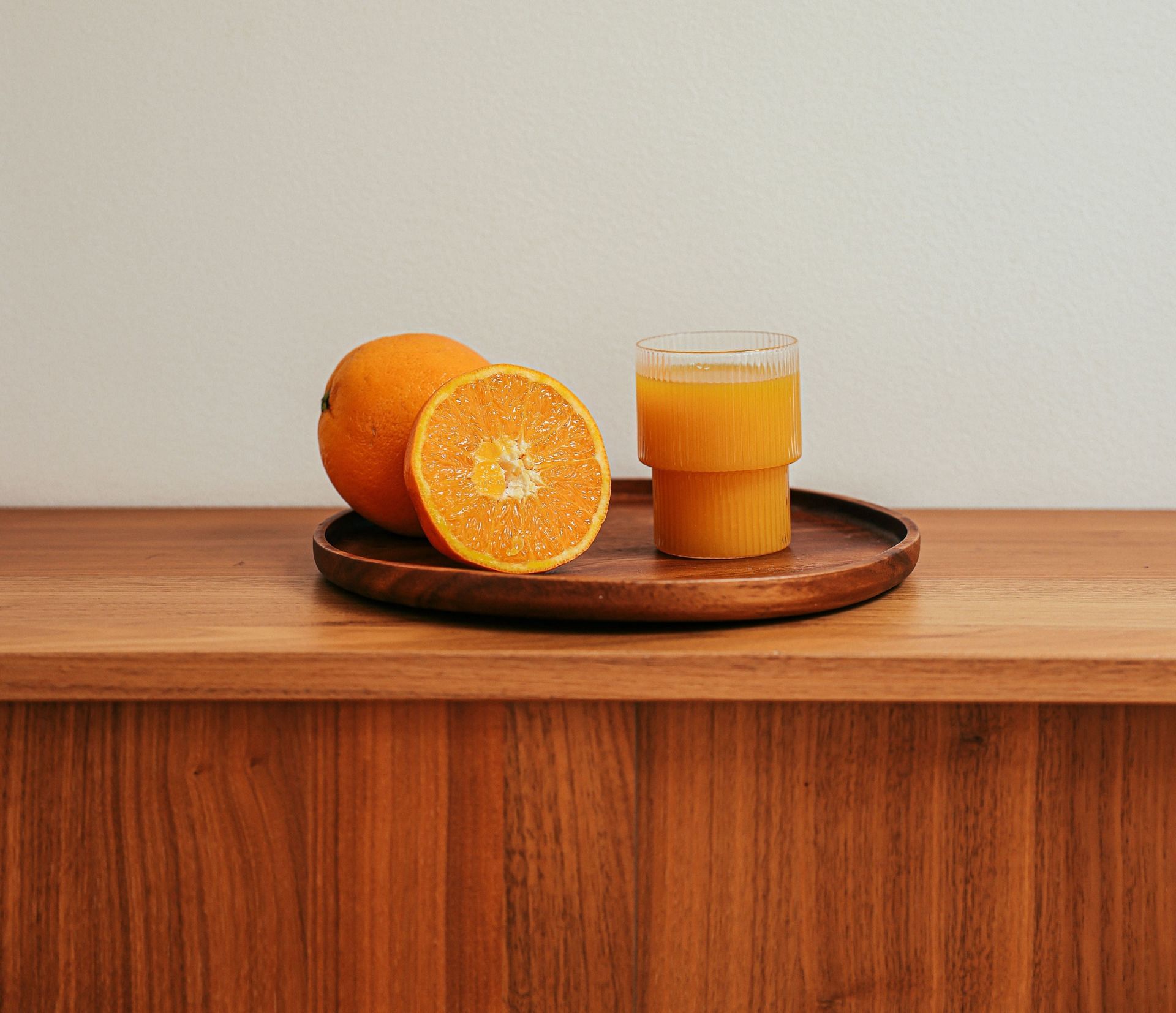 Curing hangover with orange juice (Image via Pexels / Cup of couple)