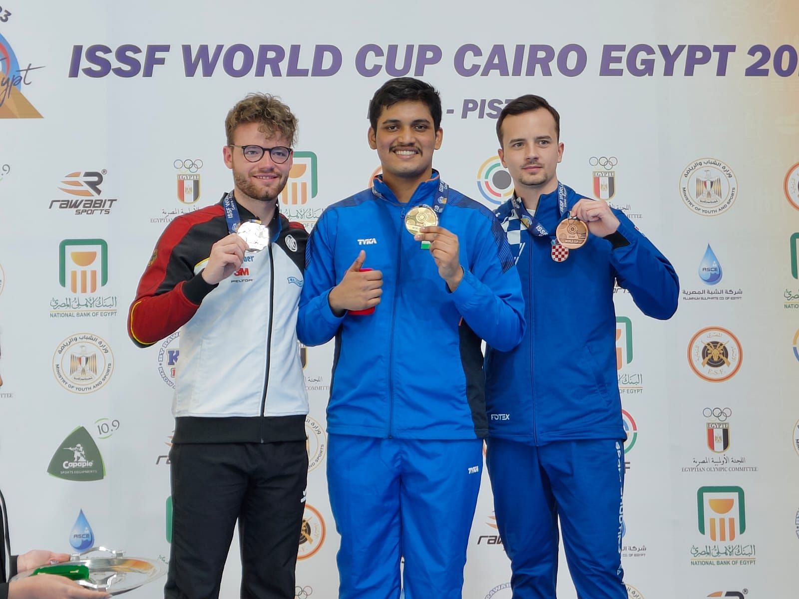 Rudrankksh Patil (center) wins a gold medal for India at ISSF World Cup Cario, Egypt (PC: SAI Media)