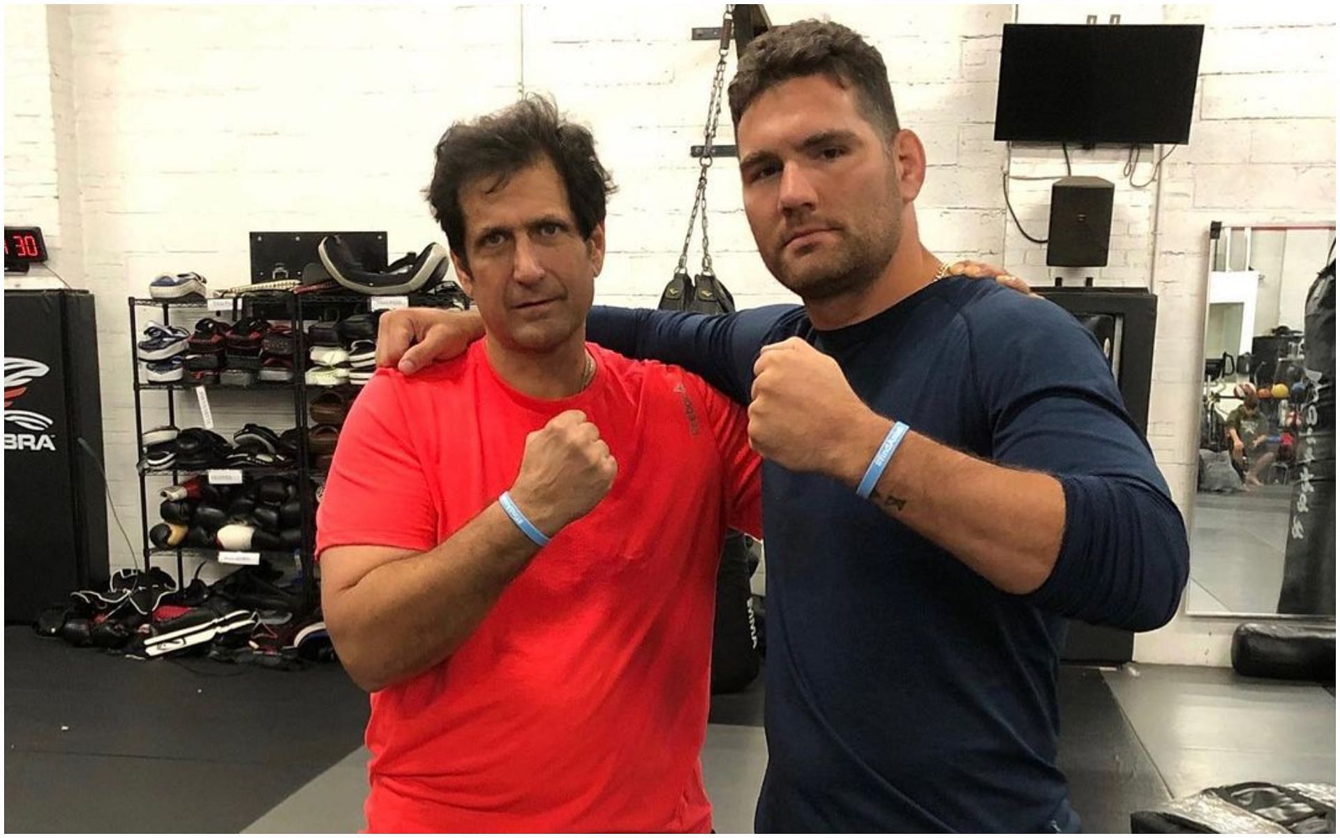 Former UFC middleweight champion Chris Weidman with coach Ray Longo