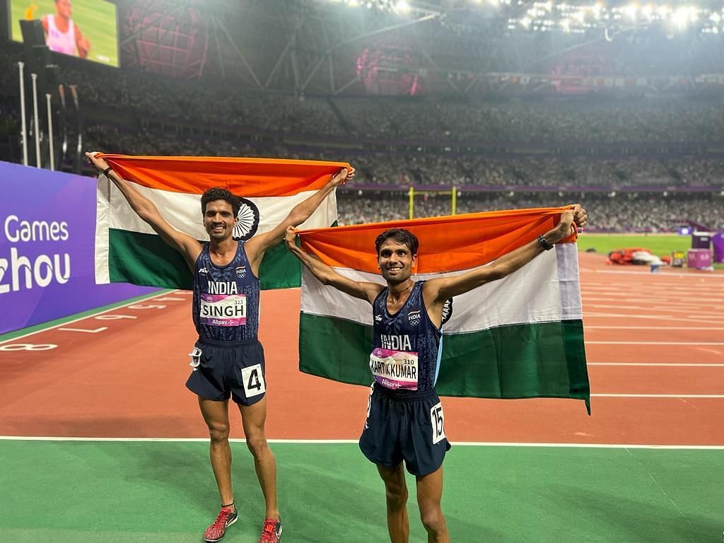 Gulveer Singh (left) and Kartik Kumar (right) celebrating after India