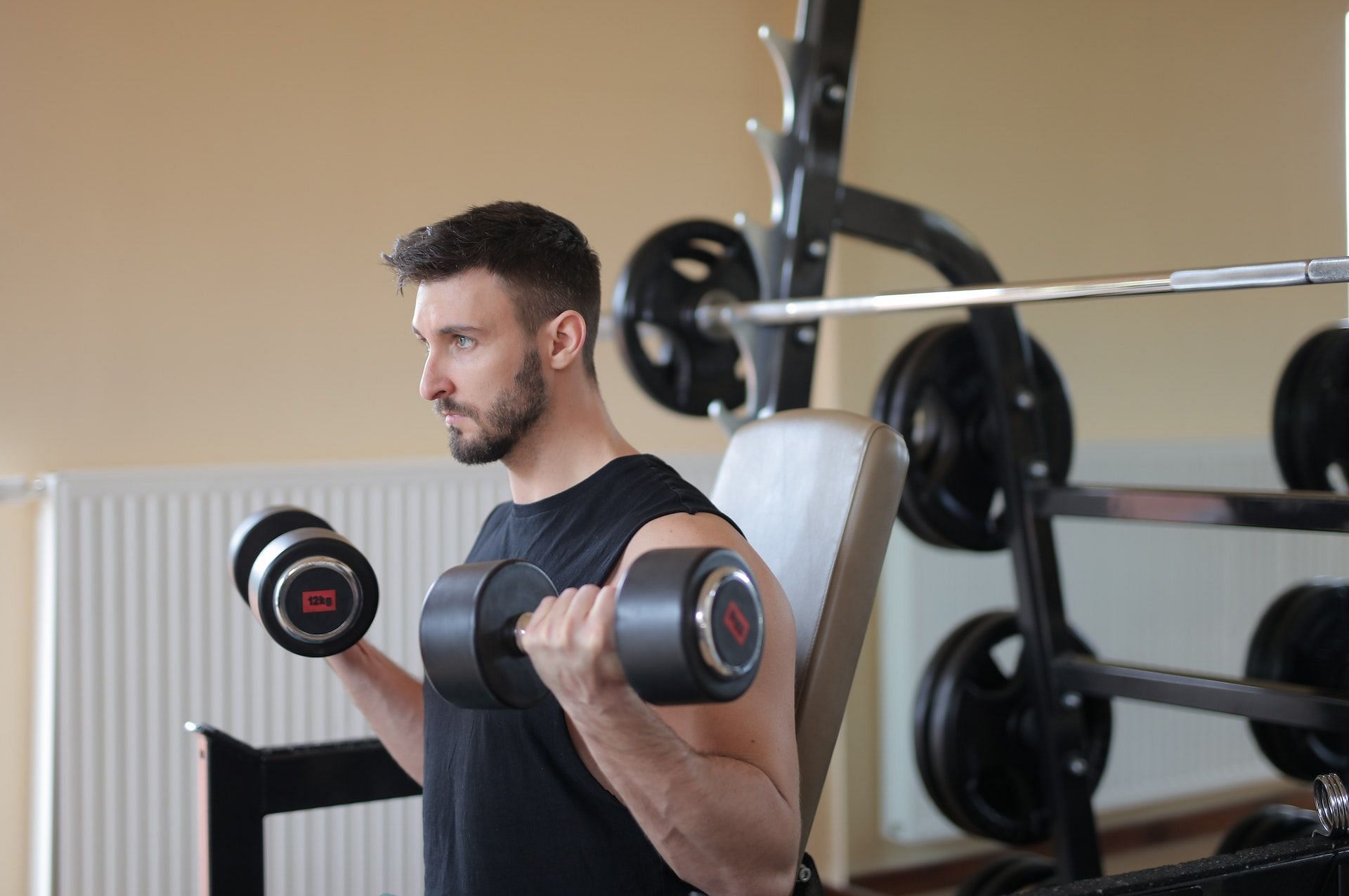 Incline dumbbell curl is a strength training exercise. (Image via Pexels/Andrea Piacquadio)