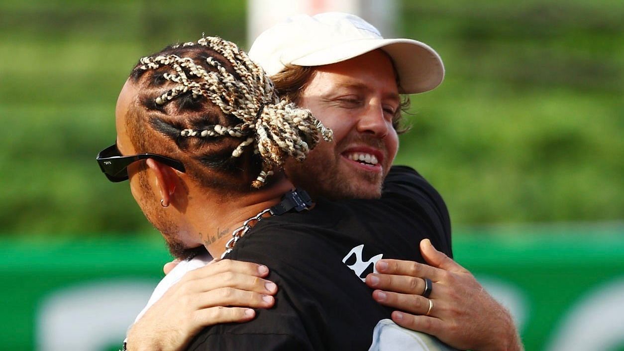 Lewis Hamilton embraces Sebastian Vettel at the Suzuka Circuit ahead of the Japanese GP