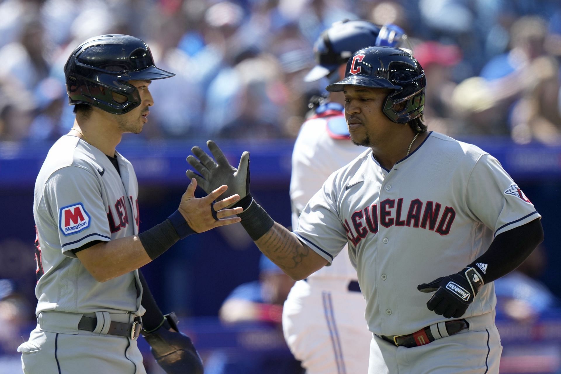 Designated hitter Jose Ramirez congratulated by teammate Steven Kwan after a home run in Toronto