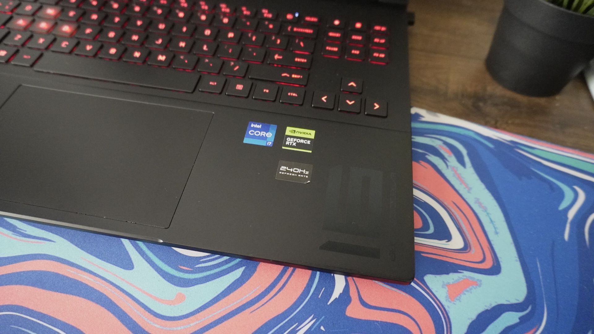 The &quot;!6&quot; branding in the bottom right of the Omen Transcend 16 laptop (Image via Sportskeeda)