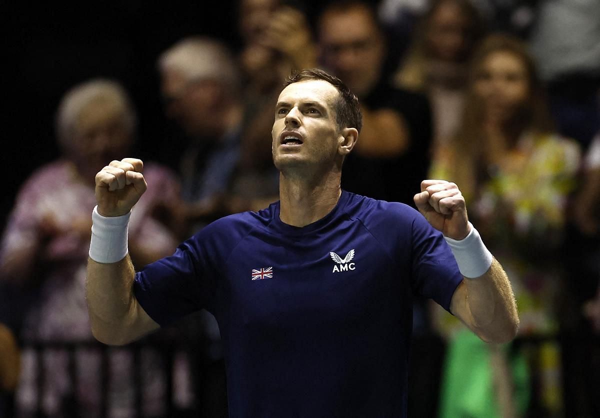 Andy Murray looks up to the sky as he celebrates his win