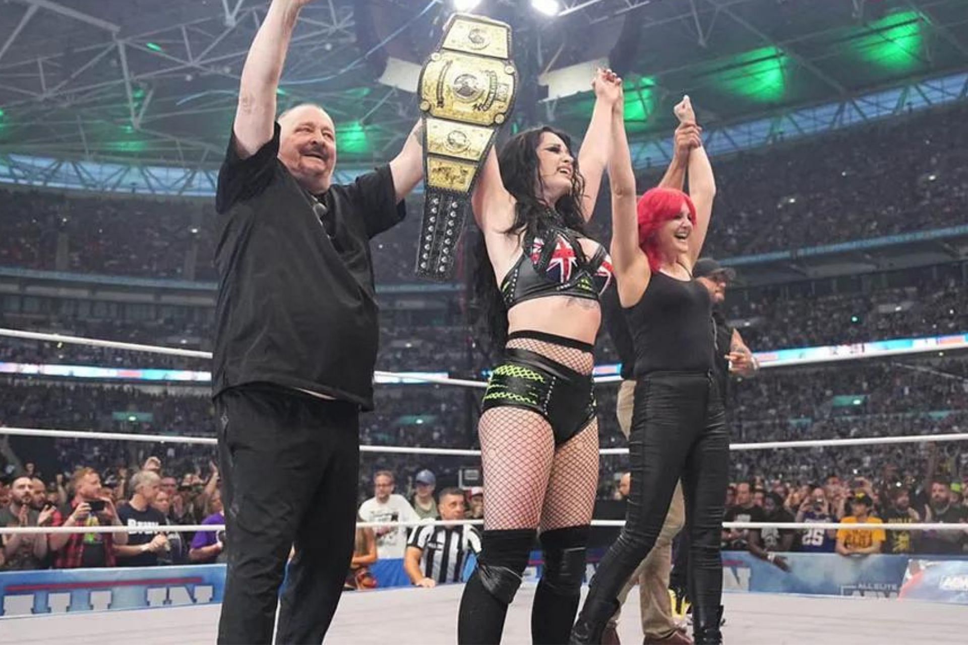 Saraya celebrating her win with parents