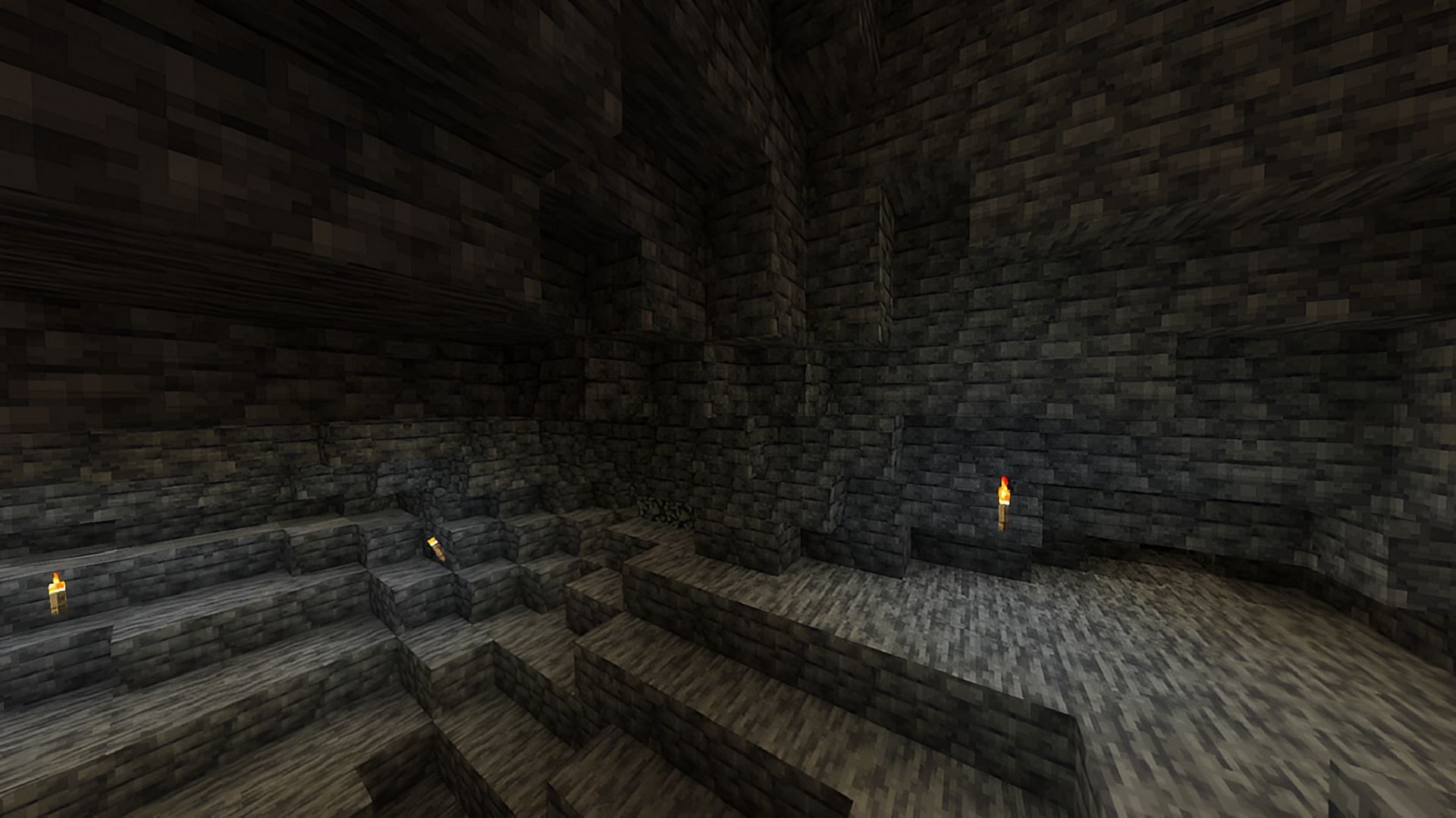 A collection of deepslate blocks underground in Minecraft.