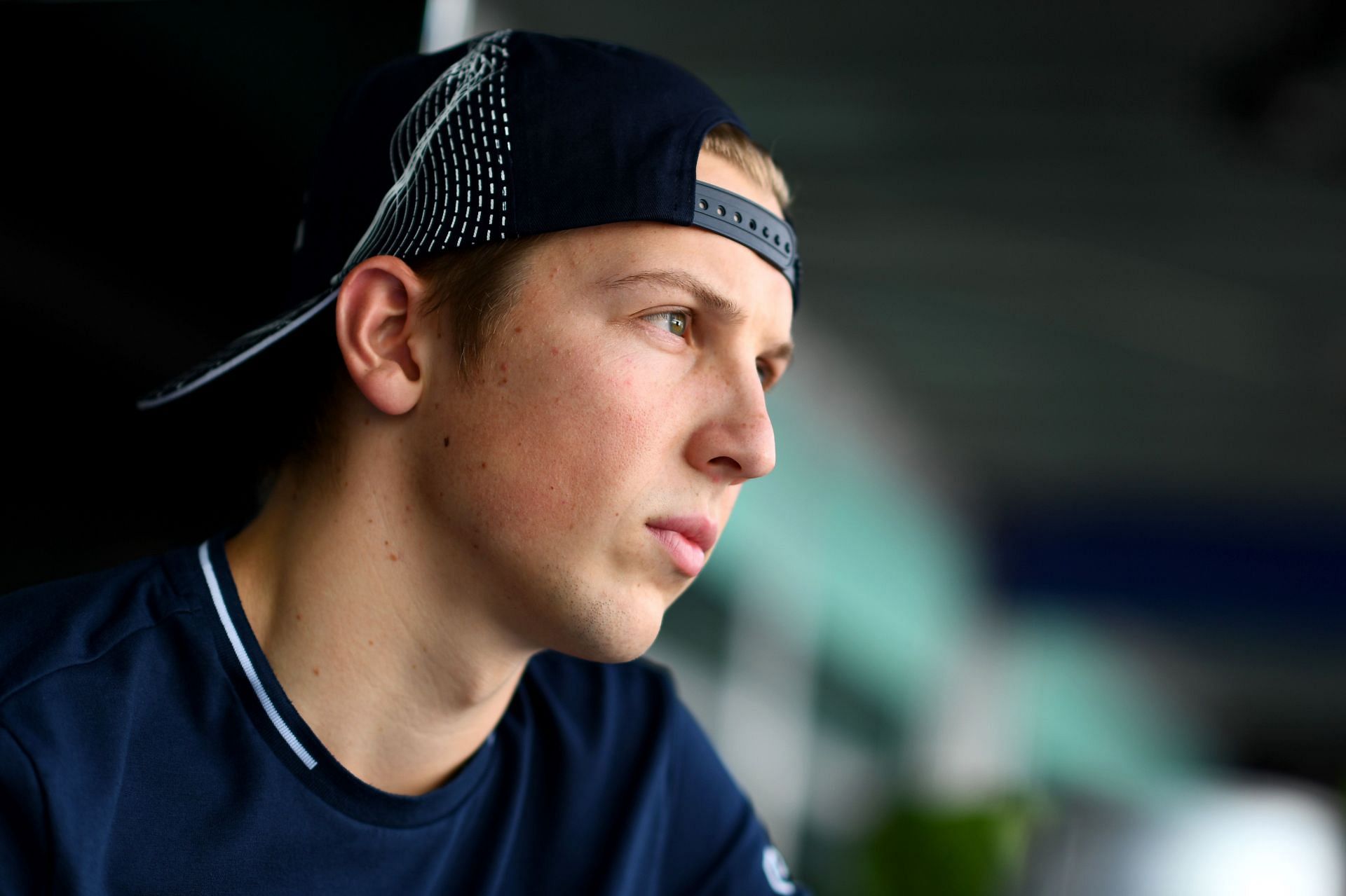 SINGAPORE, SINGAPORE - SEPTEMBER 14: Liam Lawson of New Zealand and Scuderia AlphaTauri looks on in the Paddock during previews ahead of the F1 Grand Prix of Singapore at Marina Bay Street Circuit on September 14, 2023 in Singapore, Singapore. (Photo by Rudy Carezzevoli/Getty Images)