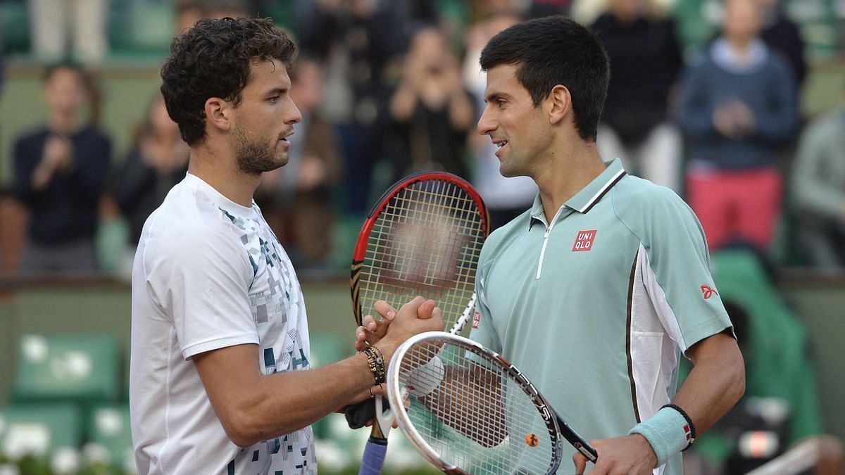 Grigor Dimitrov greets Novak Djokovic after their match at the 2013 French Open