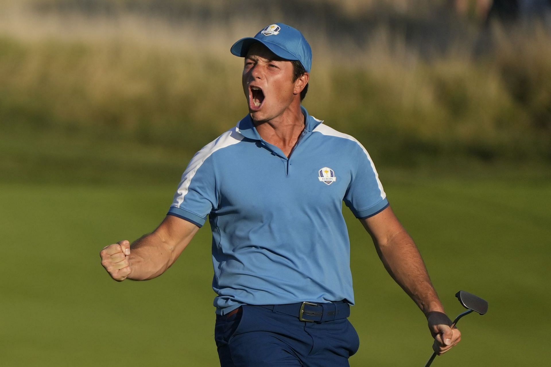 Europe&#039;s Viktor Hovland reacts and celebrates after his birdie putt earned Europe a tie in his afternoon Fourballs match (Image via AP Photo)