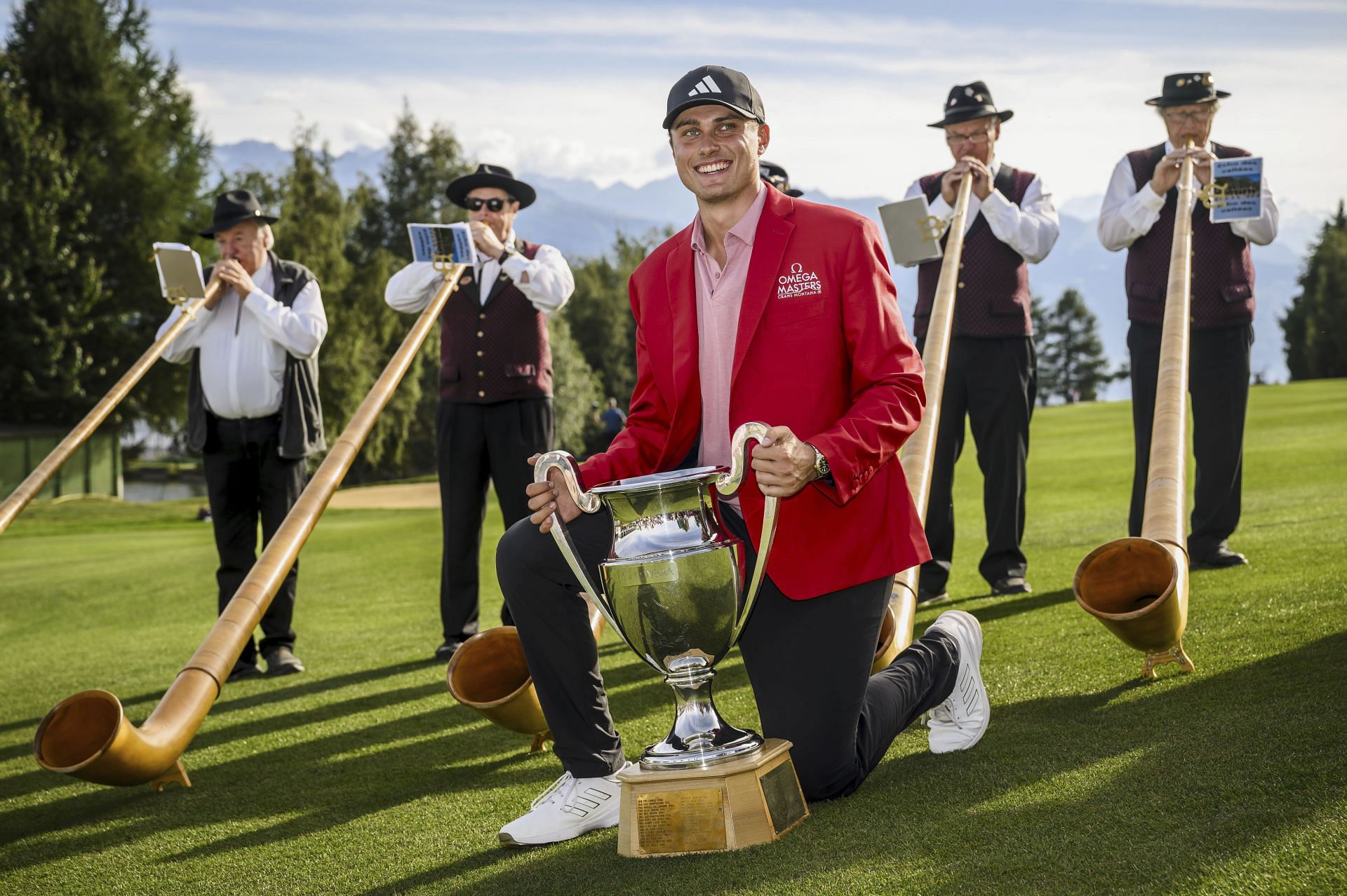 Winner Ludvig Aberg of Sweden poses with the trophy of the Omega European Masters (Image via Getty)