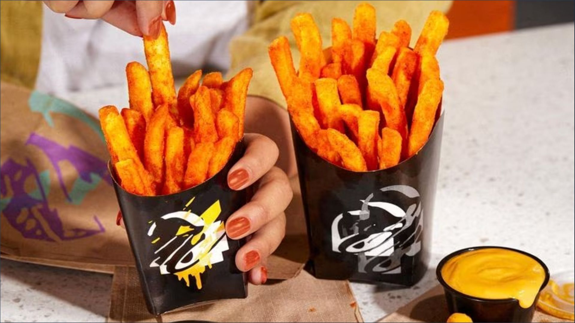 New Nacho Fries with Vegan Cheese Sauce hit the chain&#039;s menu next month on October 12 (Image via Taco Bell)