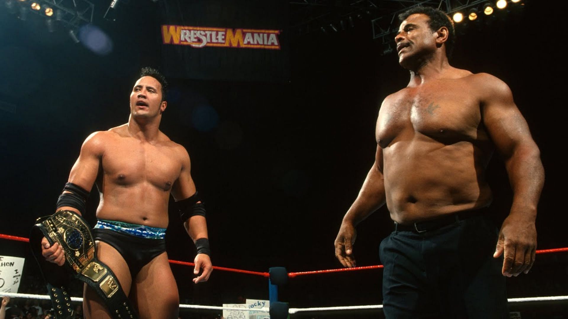 The Rock (left) and Rocky Johnson (right) at WrestleMania 13
