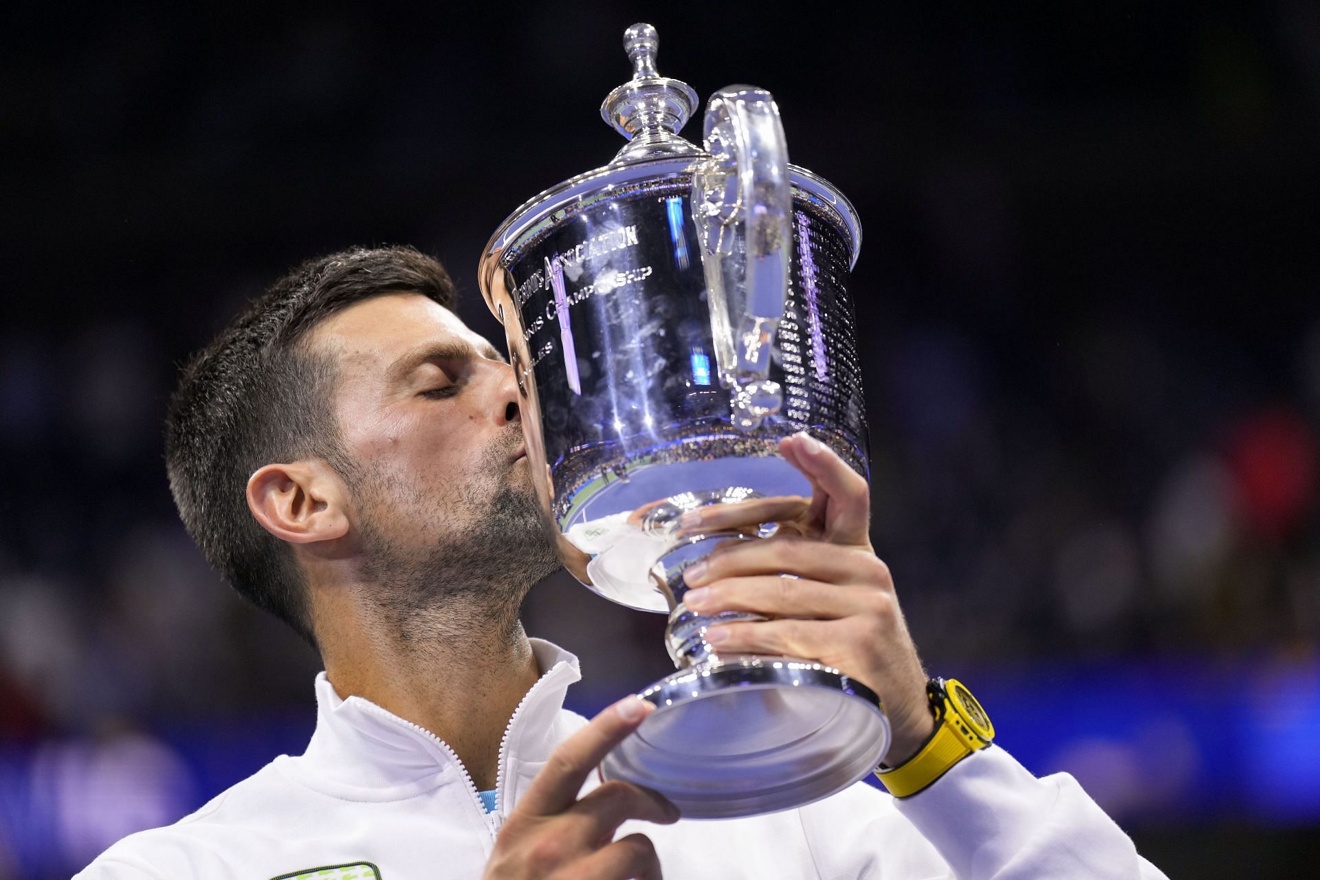 Novak Djokovic kisses his US Open title