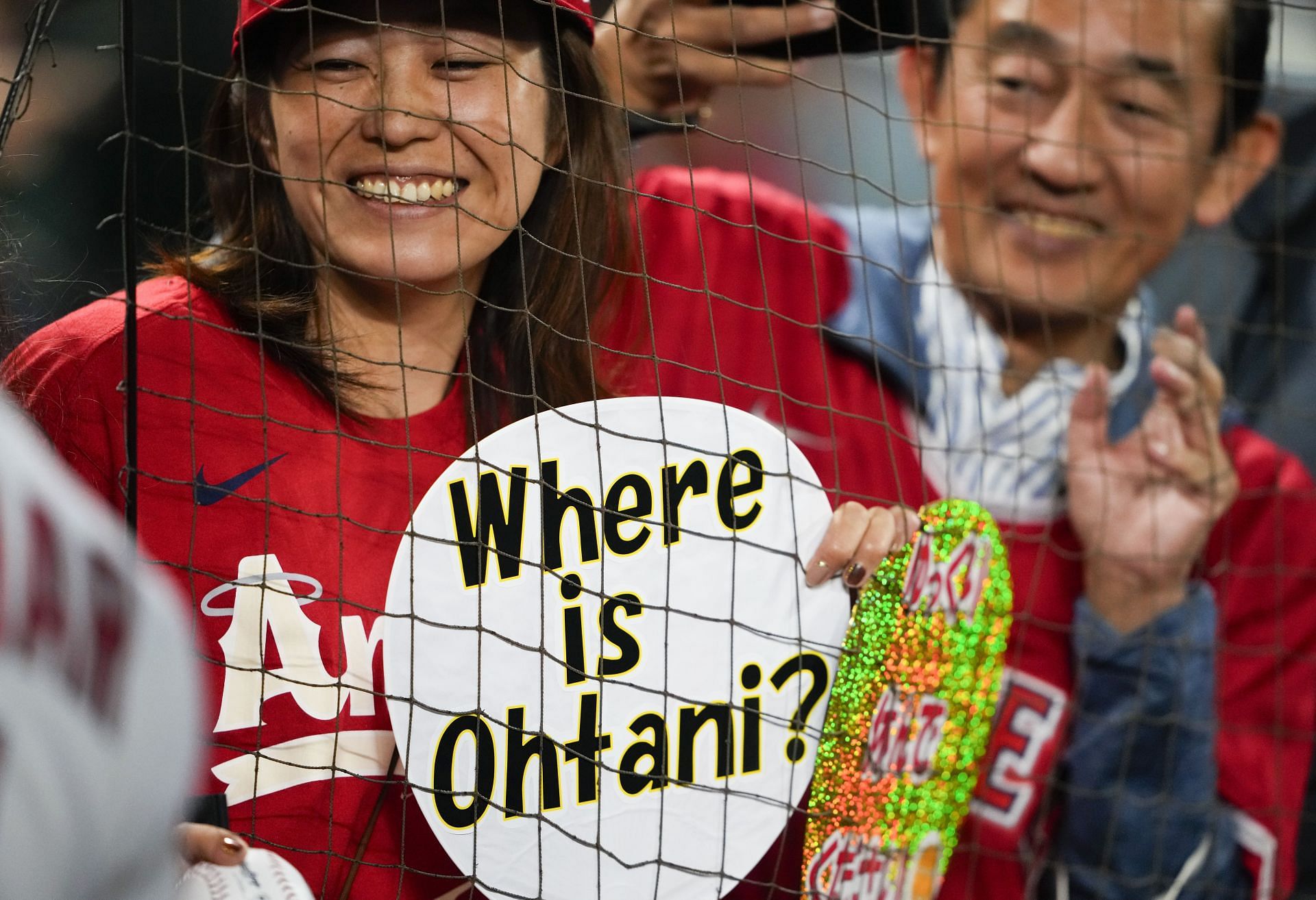 A fan holds a sign reading &quot;Where is Ohtani?,&quot; as Shohei Ohtani was not in the starting lineup against the Seattle Mariners