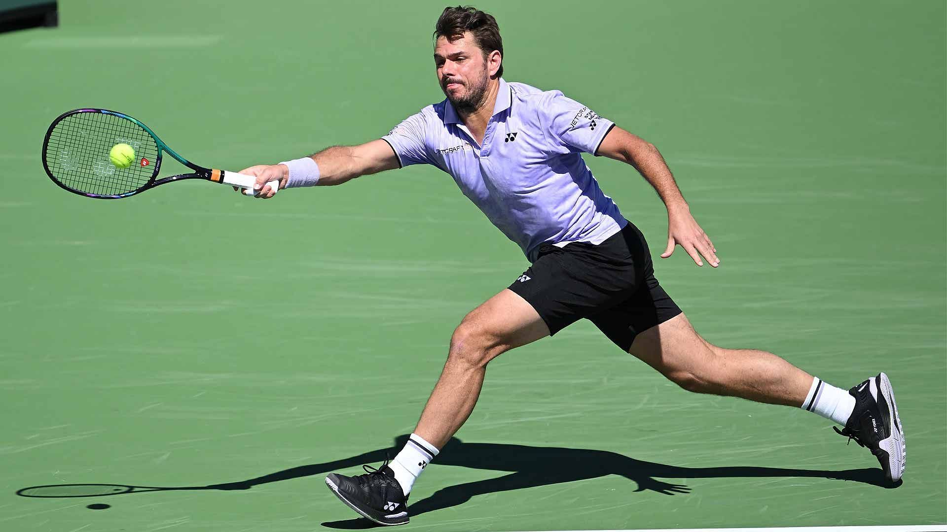 Stan Wawrinka retrieves a ball at the 2023 Indian Wells Masters