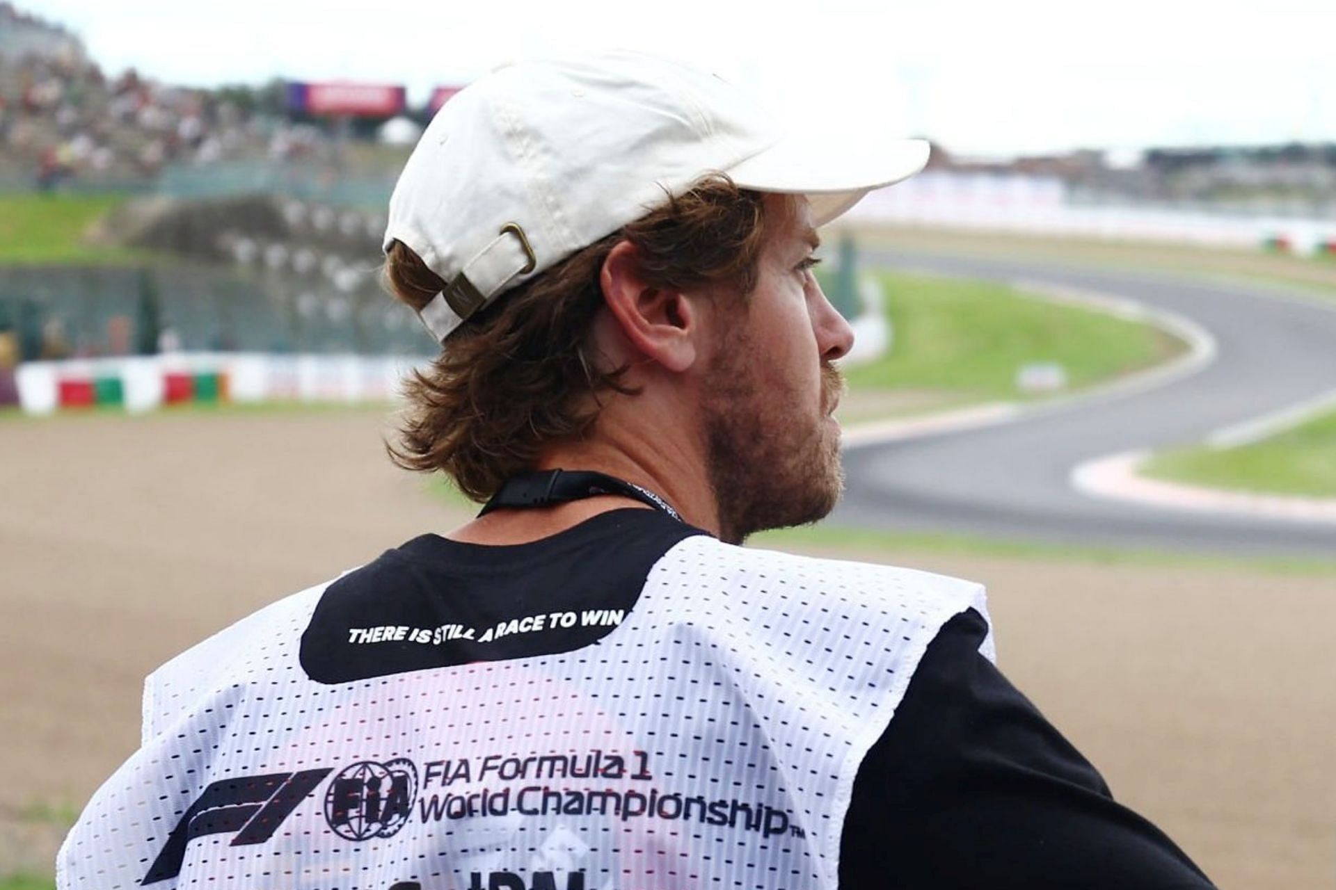 Former F1 driver Sebastian Vettel looking on at the track during practice at the 2023 F1 Japanese Grand Prix (Image via Twitter/@Vetteleclerc)