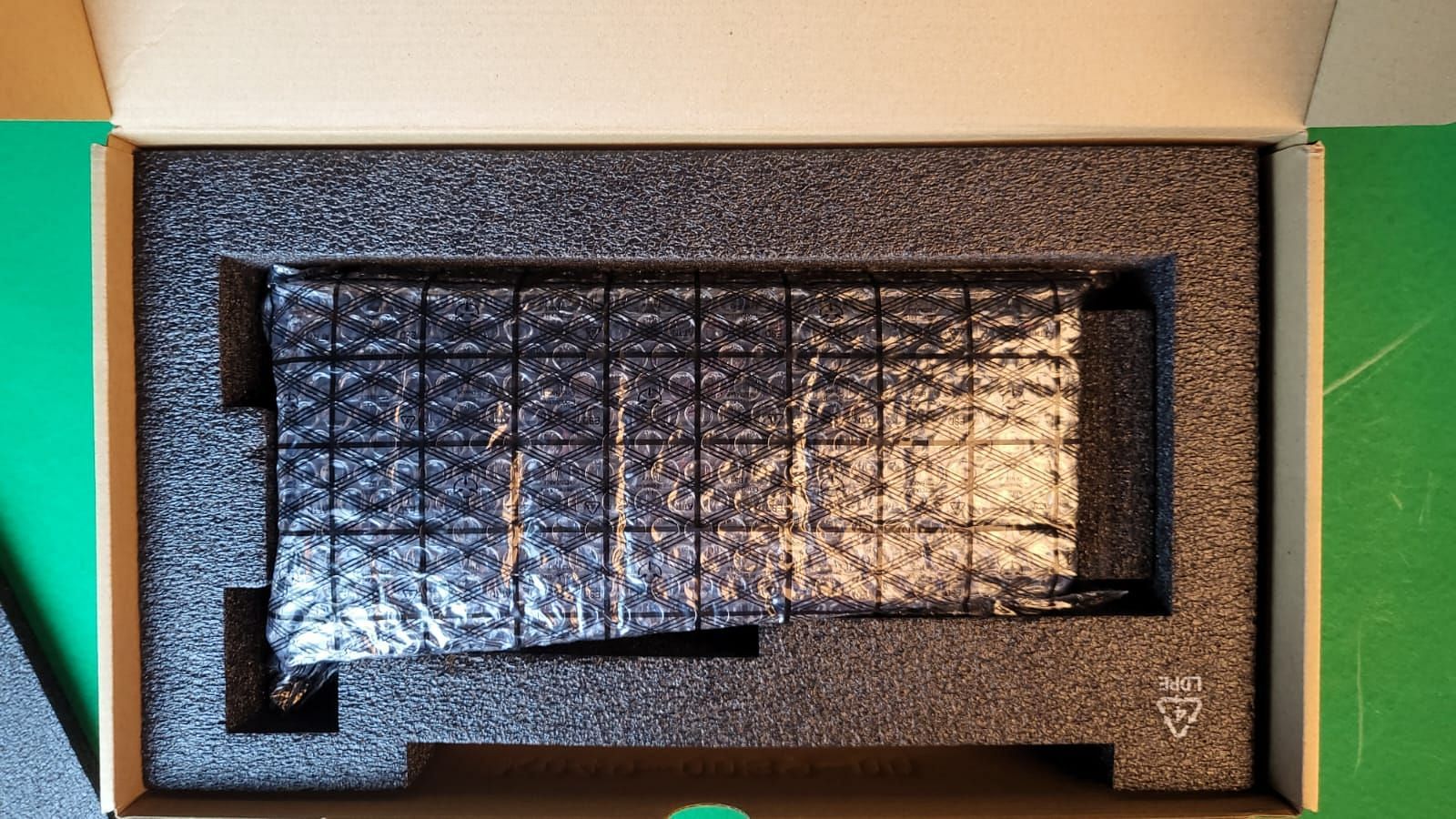 Sapphire Radeon RX 7700 XT Pulse Unboxed (Image via Sportskeeda)