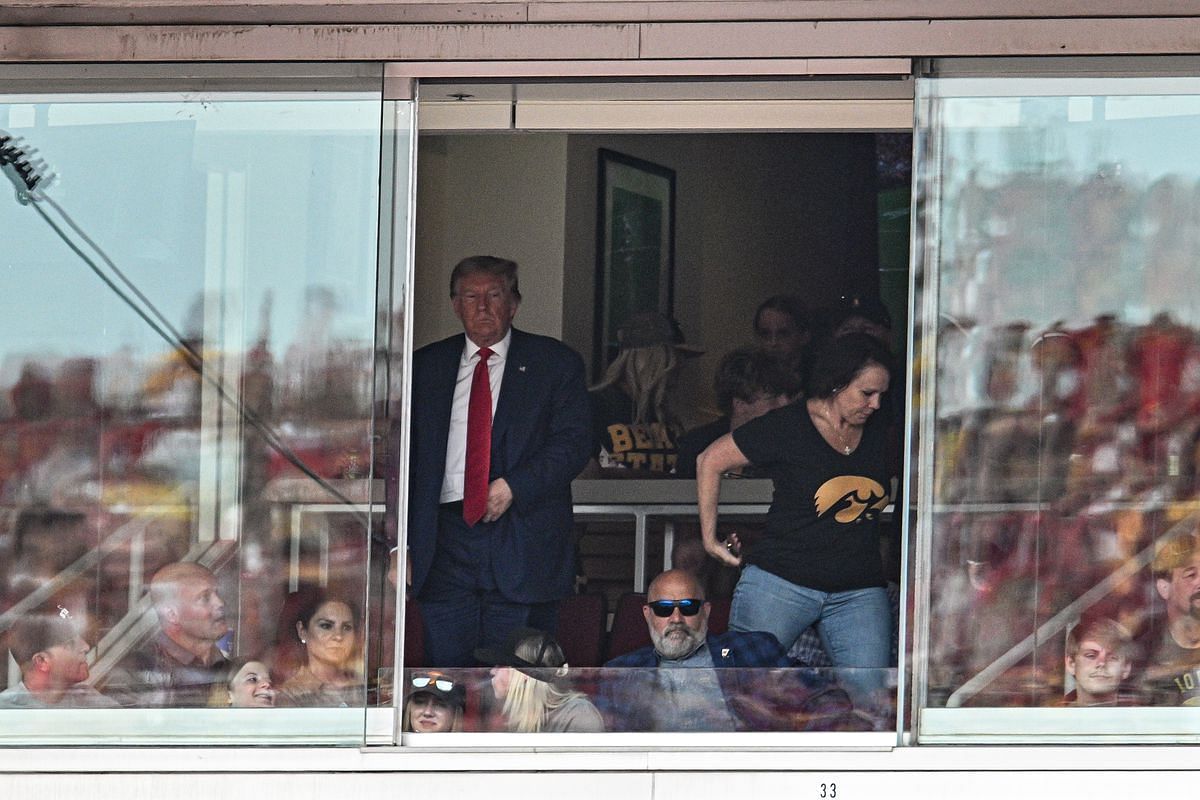Donald Trump watches from his private box at Jack Trice Stadium in Ames