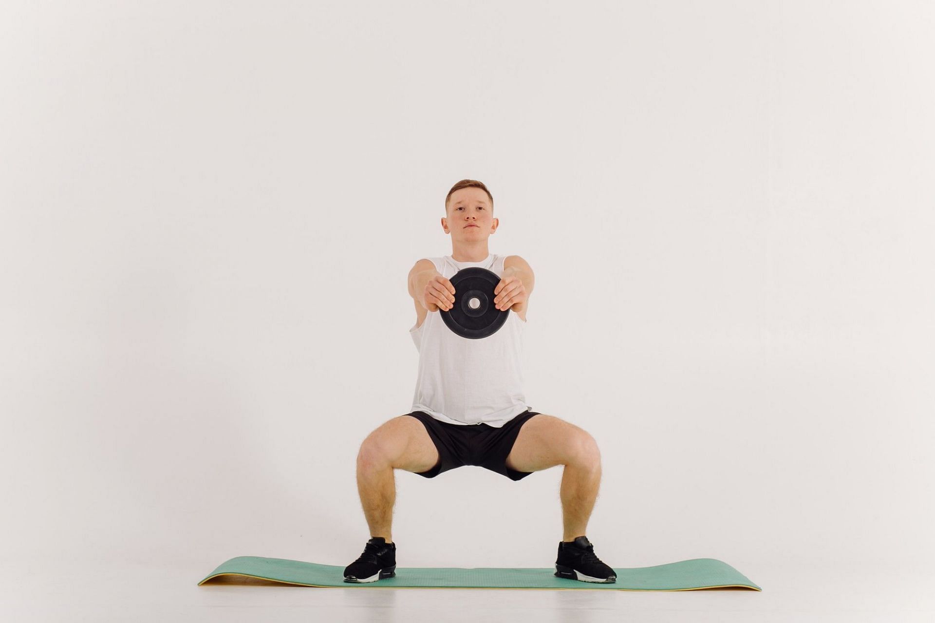 Sumo squats for inner thighs. (Image credits: Freepik)