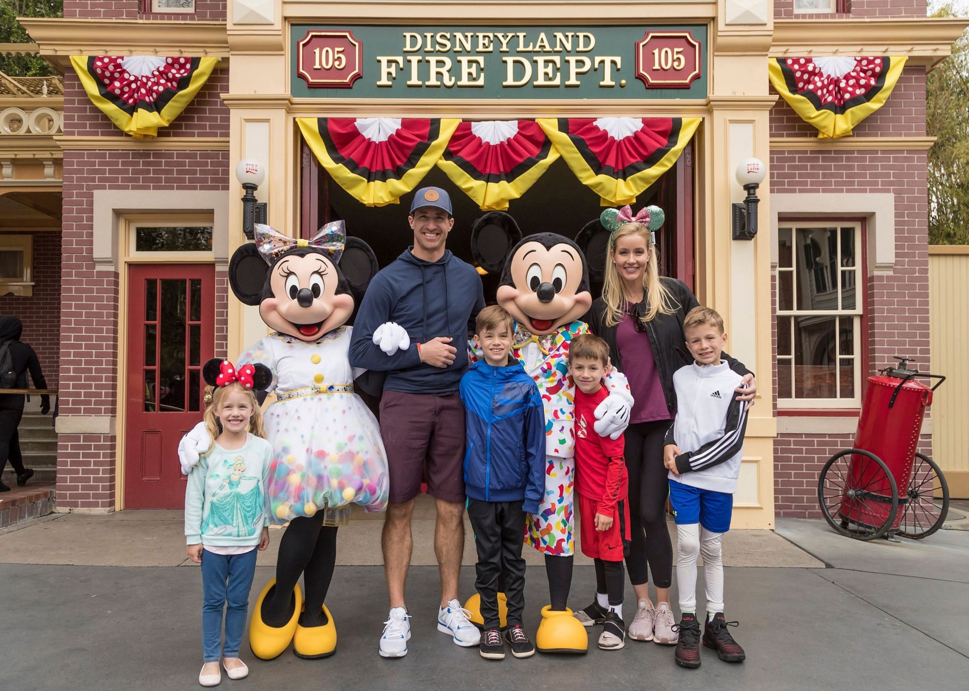 Drew Brees And Family Celebrate Vacation With Mickey Mouse And Minnie Mouse At Disneyland Park
