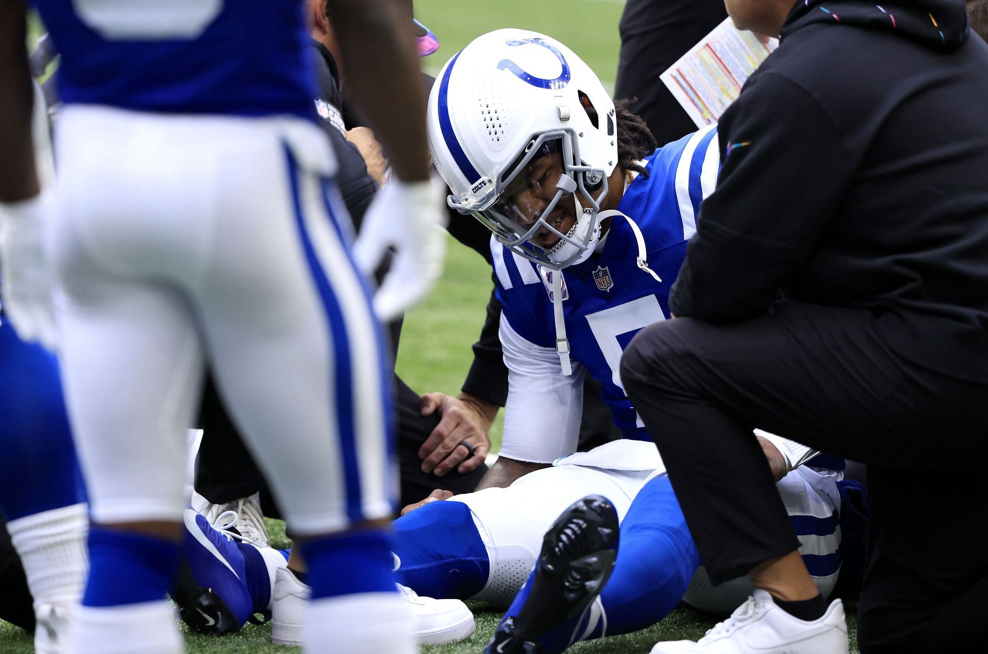 Anthony Richardson being attended to after taking a hit