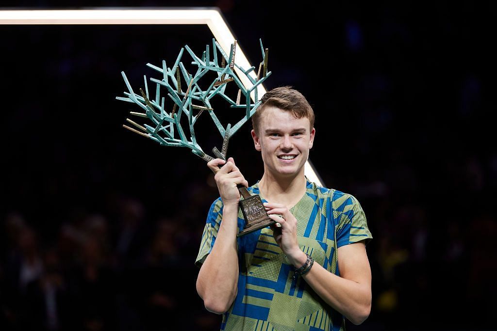 Holger Rune poses with the 2022 Paris Masters trophy