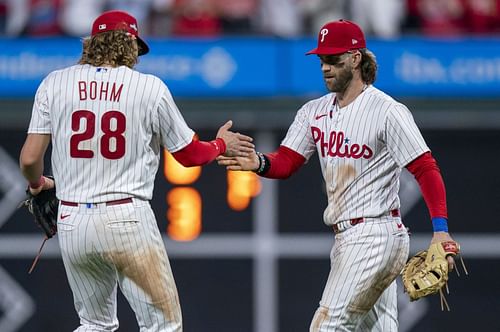 Philadelphia Phillies' Bryce Harper celebrates with Alec Bohm after the team's 4-1 win over the Miami Marlins