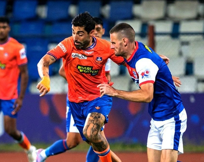 Bengaluru FC and FC Goa players tussling for the ball. 
