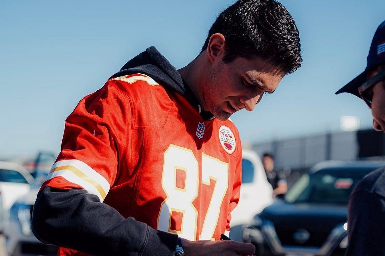Esteban Ocon of Alpine wearing a Travis Kelce jersey at the paddocks ahead of the F1 United States Grand Prix in Austin, Texas 
