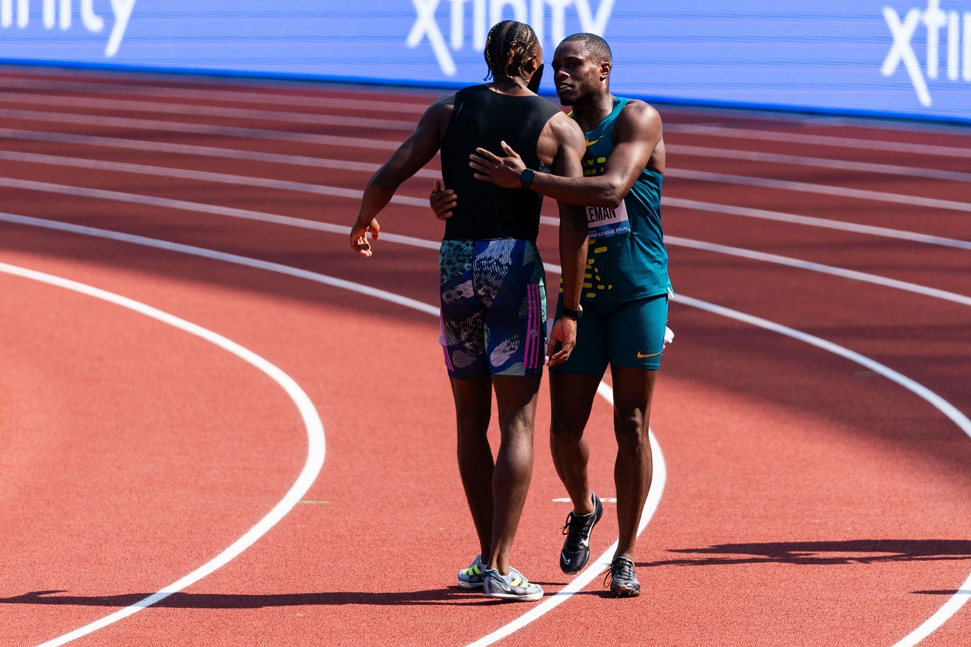 Christian Coleman and Noah Lyles congratulate each other after the Men&#039;s 100m event in Eugene, Oregon.