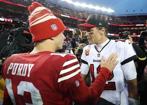 Former Buccaneers QB Tom Brady (r) with 49ers QB Brock Purdy (l)