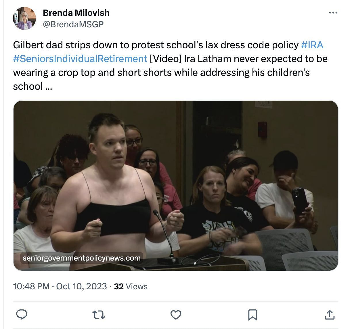 Latham, father of four, strips down at a school board meeting to protest about the new dress code policy. (Image via Twitter)