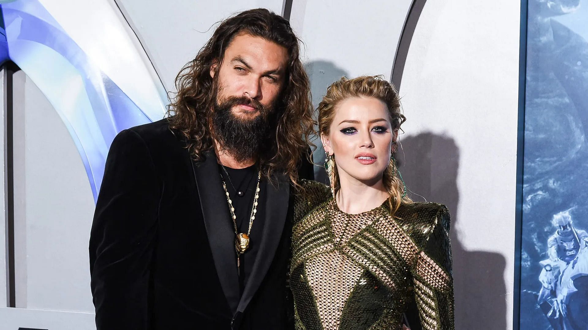 Jason Momoa with Amber Heard at an Aquaman event (Image via Presley Ann/Film Magic)