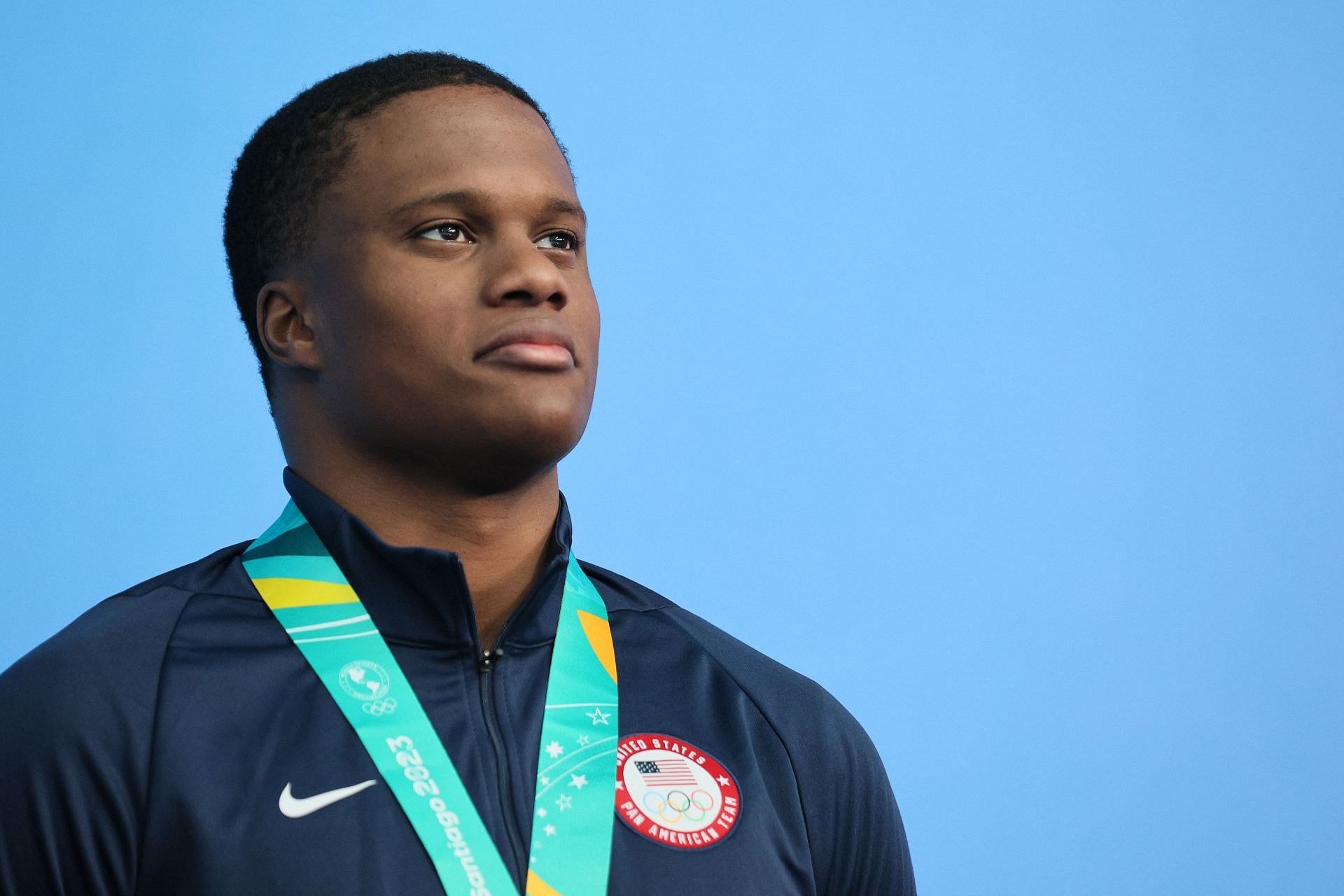 David Curtiss poses on the podium of the Men&#039;s 50m Freestyle final at the 2023 Pan Am Games in Santiago, Chile.