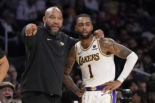 Darvin Ham (left) talks with Lakers' starting point guard D'Angelo Russell (right)