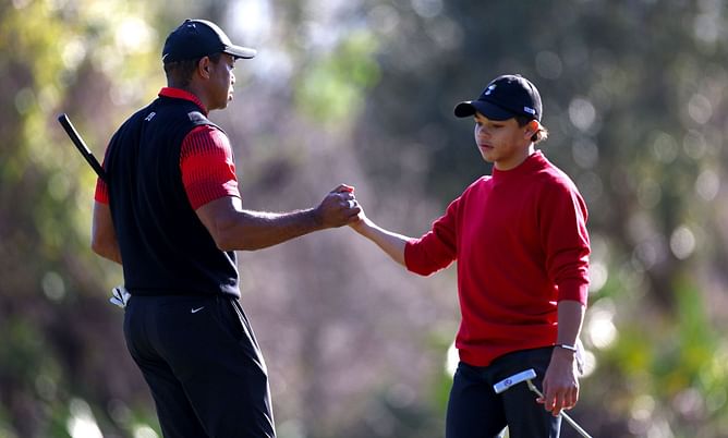 Charlie Woods seen practicing with dad Tiger Woods, fueling PNC Championship participation speculation