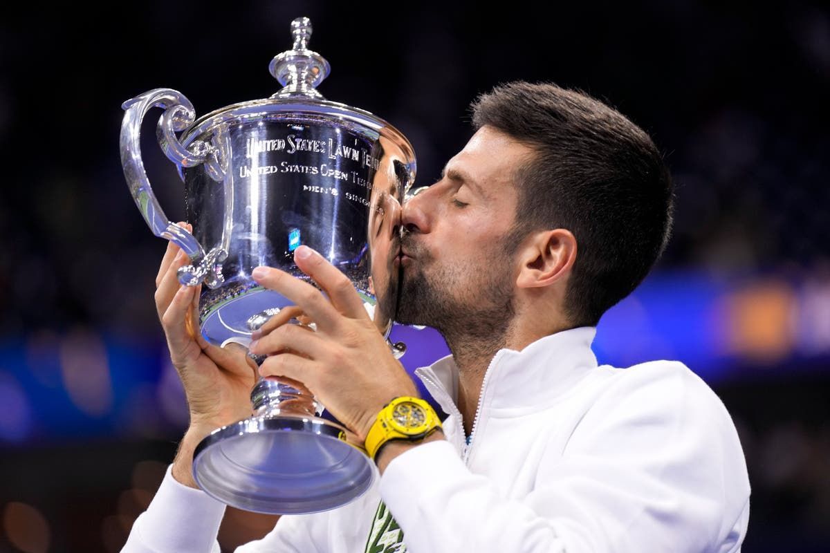 Novak Djokovic poses with the 2023 US Open trophy