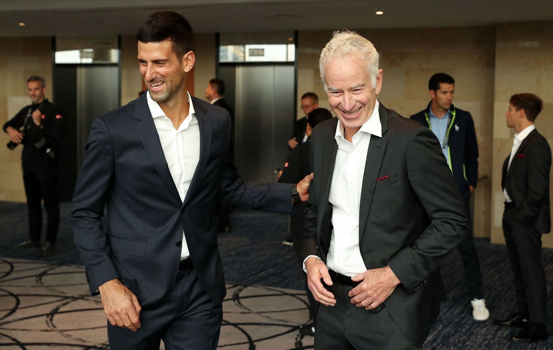 Djokovic (left)  and John McEnroe