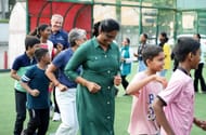 El Moutawakel and PT Usha engaging with the children