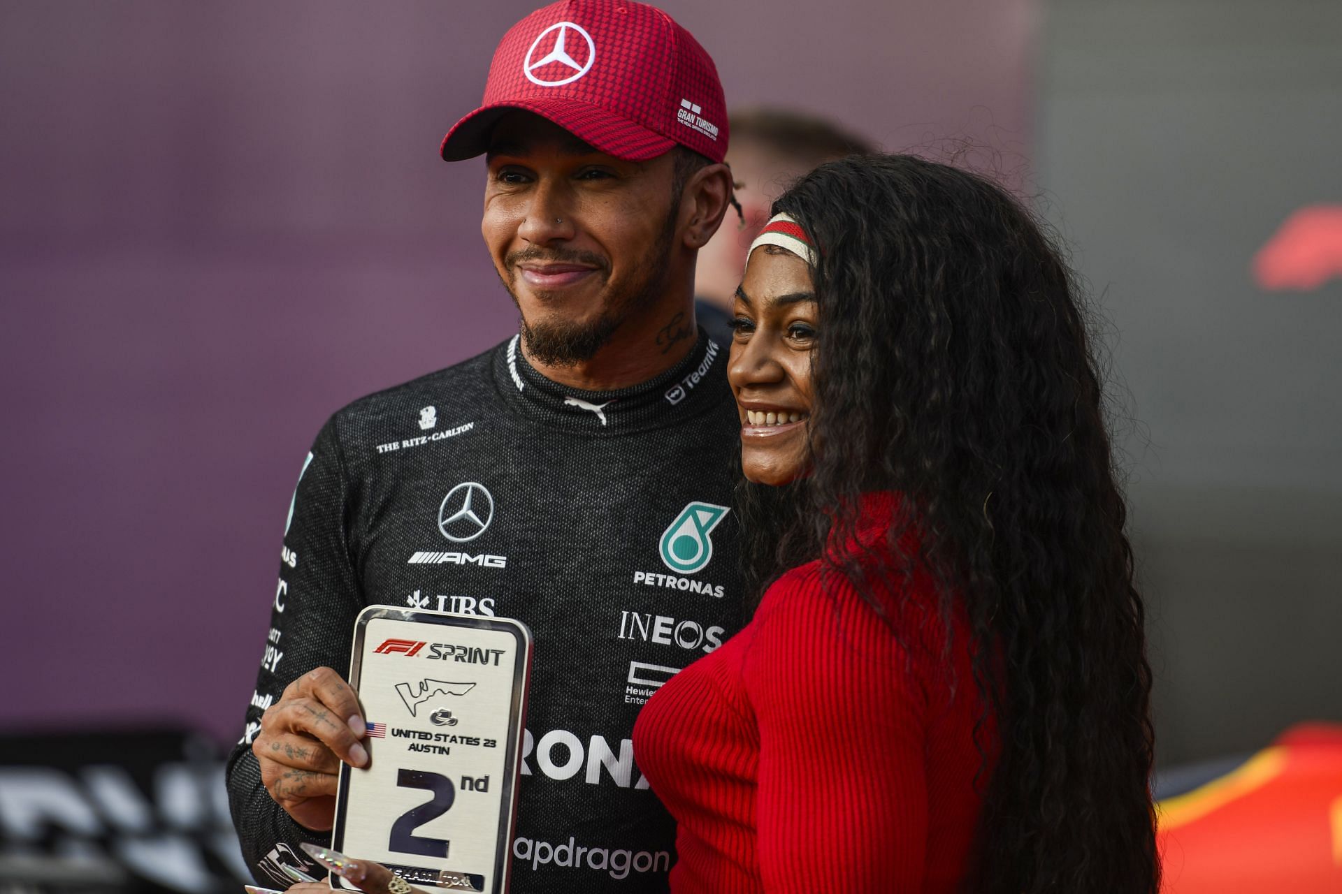 Lewis Hamilton of Great Britain and Mercedes pose for a photo with Sha&#039;Carri Richardson in Parc Ferme after the Sprint ahead of the F1 Grand Prix of United States at Circuit of The Americas in Austin, Texas.
