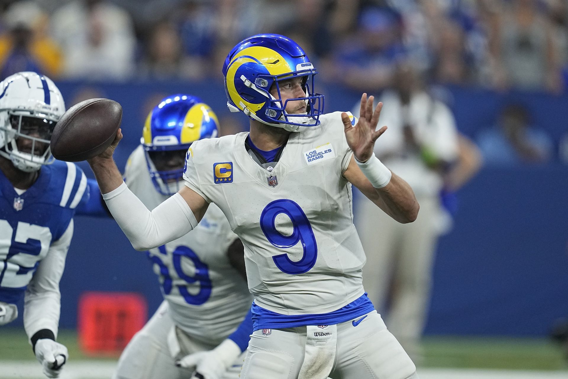 Los Angeles Rams quarterback Matthew Stafford (9) works in the pocket  before being sacked by Ci …