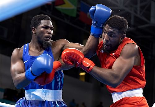 Joshua Edwards of Team United States (blue) punches Fernando Alejandro Arzola of Team Cuba (red) on Boxing - Men's +92kg semifinals at the 2023 Pan Am Games in Santiago, Chile