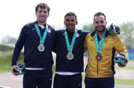 Cameron Wood, Kamren Larsen, and Carlos Ramirez of Team Colombia pose on the Men's BMX Racing podium at the 2023 Pan Am Games on October 22, in Santiago, Chile.