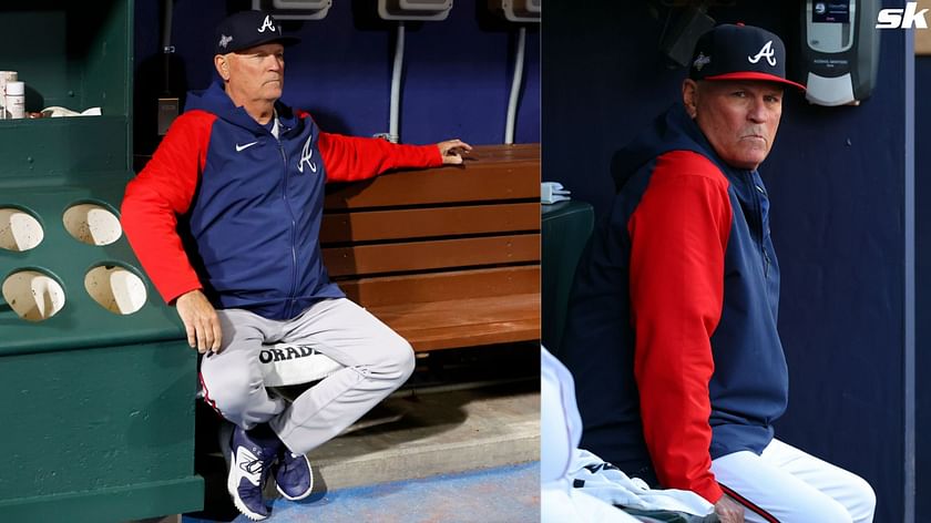 Atlanta Braves manager Brian Snitker, left, talks with a fan