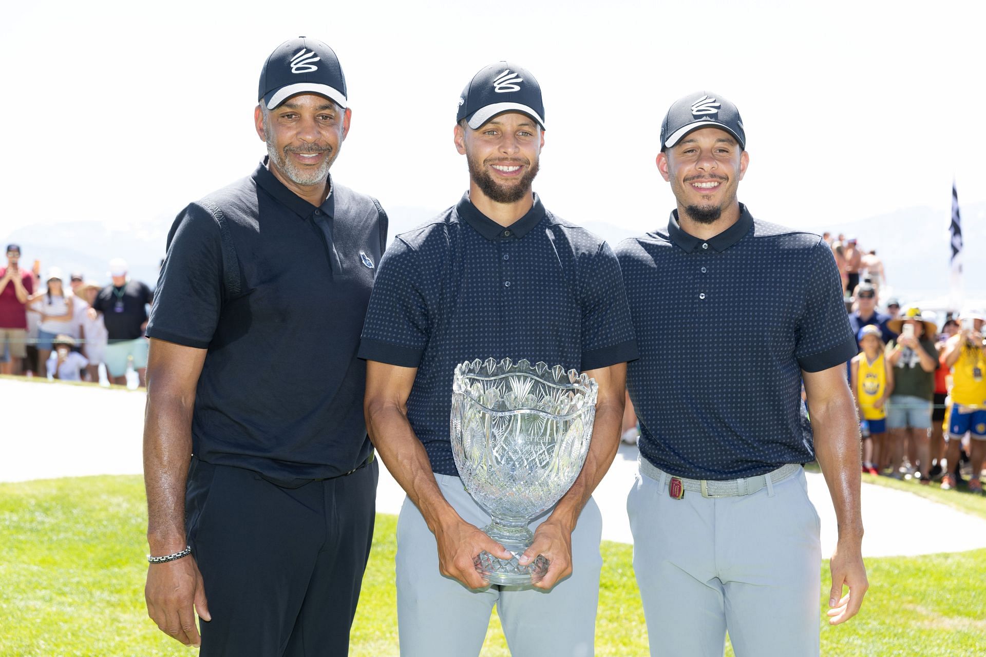 Dell Curry (right) with his children after Steph Curry (middle) won the American Century Championship